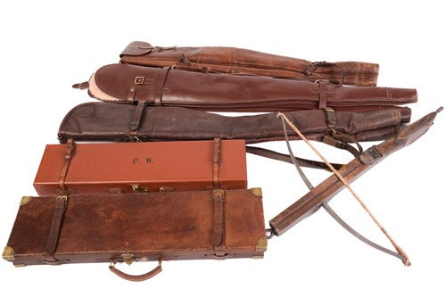 Lot 339 - A leather shotgun case, with brass corners and...