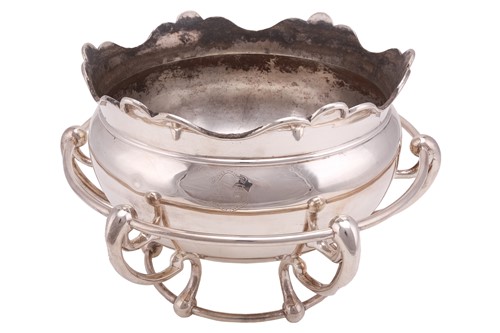 Lot 575 - An Art Nouveau punch bowl sitting within an...