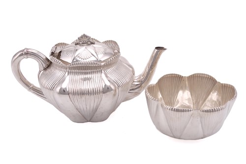 Lot 493 - A Victorian bachelor tea pot, oval with ribbed...