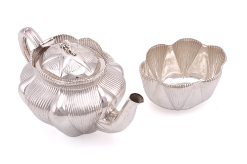 Lot 493 - A Victorian bachelor tea pot, oval with ribbed...