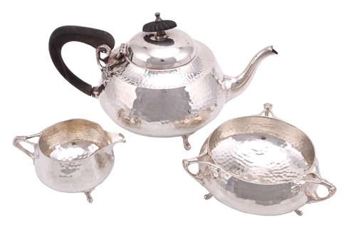 Lot 492 - An Art Nouveau three piece tea set, circular...