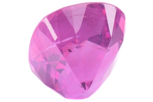 Lot 337 - A 5.10ct cushion shape pink sapphire,...