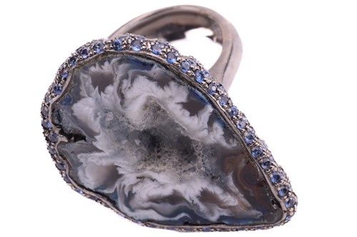 Lot 228 - A quartz geode ring of pear form, the black...