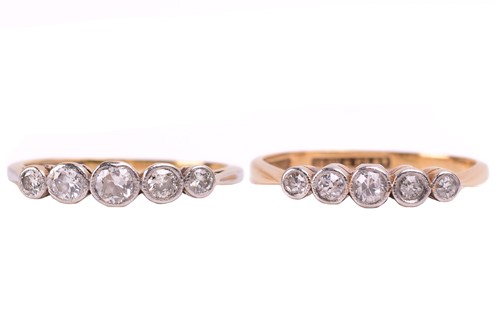 Lot 266 - Two diamond five stone rings, the first set...