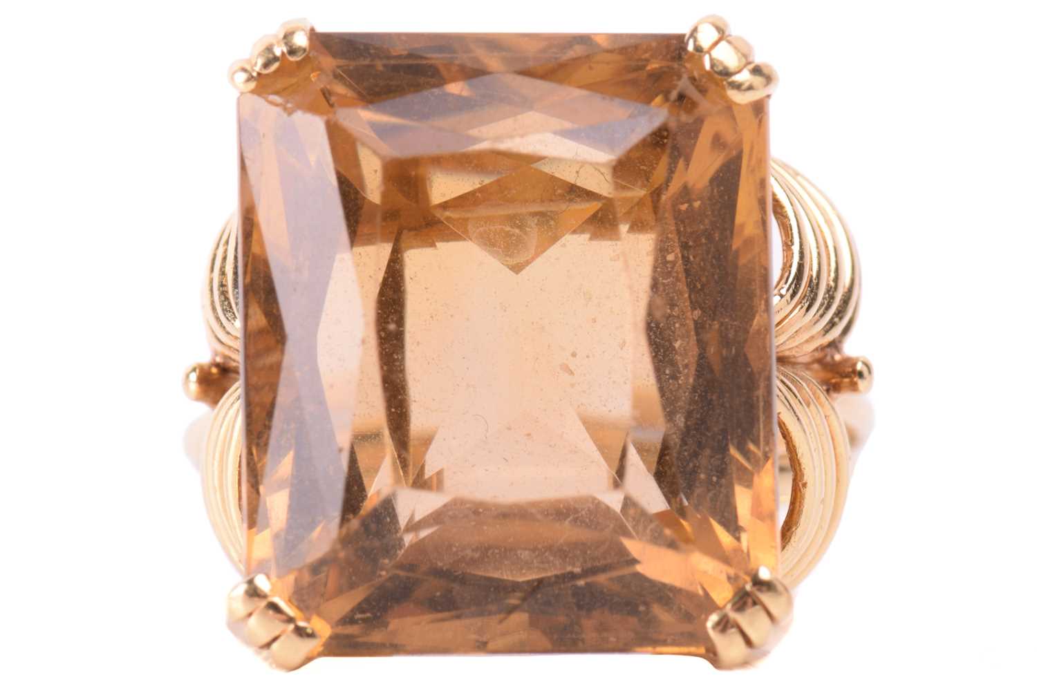 Lot 19 - A single stone citrine dress ring, the large...