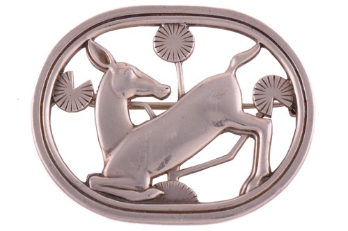 Lot 330 - Georg Jensen - a brooch depicting a kneeling...