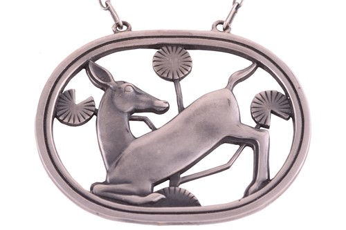 Lot 328 - Georg Jensen - a necklace with kneeling fawn...