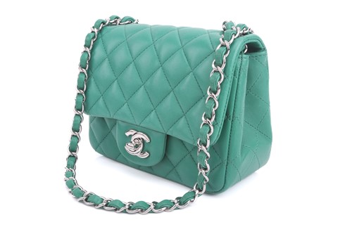 Lot 7 - Chanel - a mini flap bag in green...