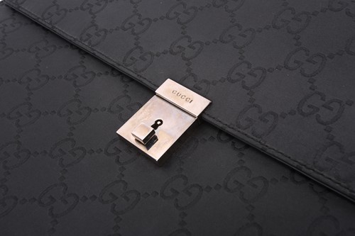 Lot 60 - Gucci - a large briefcase in black jacquard...