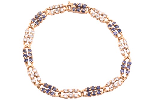 Lot 55 - A French sapphire and diamond line bracelet;...