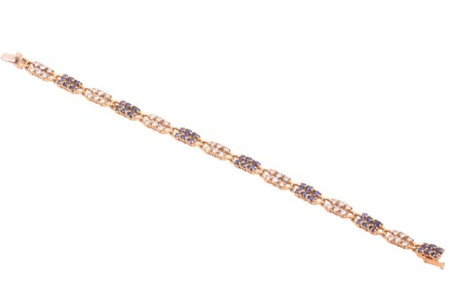 Lot 55 - A French sapphire and diamond line bracelet;...