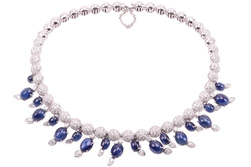 Lot 323 - A diamond and sapphire fringe choker by Stefan...