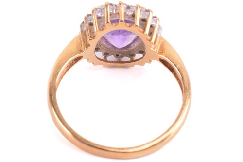 Lot 193 - An amethyst and diamond cluster ring, set with...