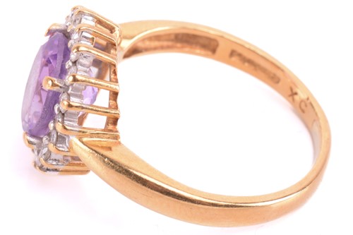 Lot 193 - An amethyst and diamond cluster ring, set with...