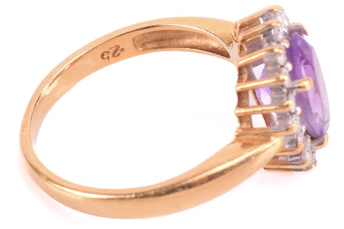 Lot 193 - An amethyst and diamond cluster ring, set with...