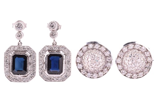 Lot 124 - A pair of sapphire and diamond pendant...