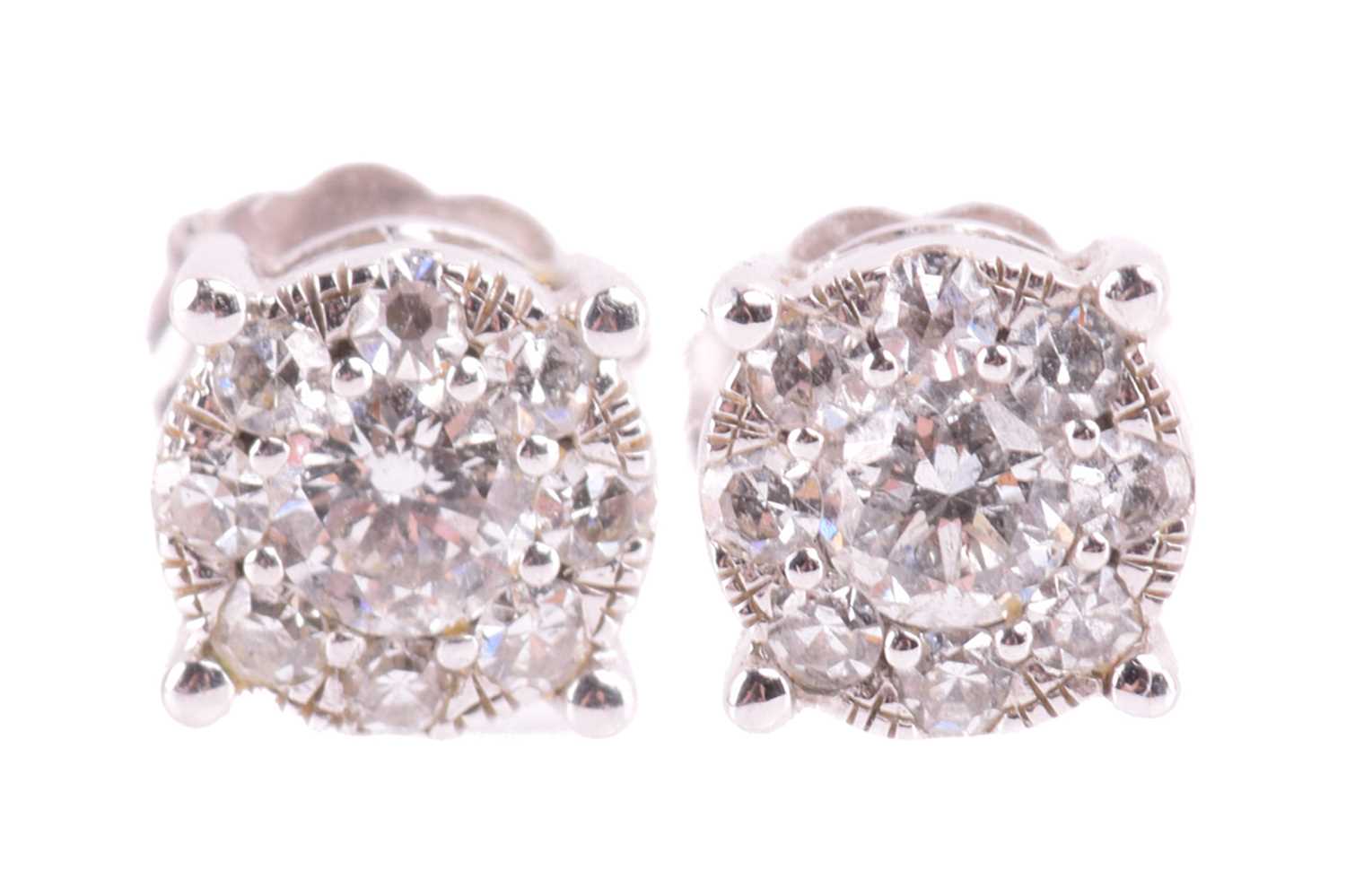 Lot 22 - A pair of diamond cluster stud earrings, the...