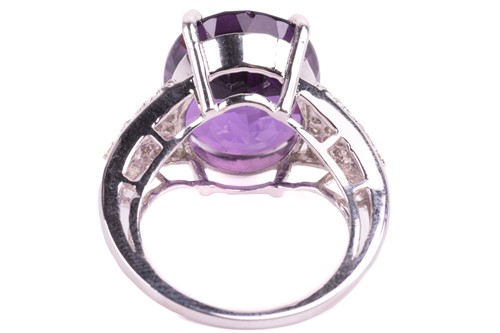 Lot 29 - A large amethyst and diamond cocktail ring,...