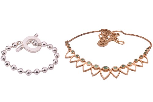 Lot 143 - Gucci. A Boule chain bracelet with a T bar...