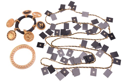 Lot 129 - Chanel - two bangles and a necklace; the first...