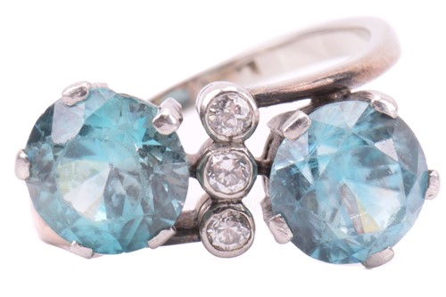 Lot 117 - A blue zircon and diamond cross-over ring,...