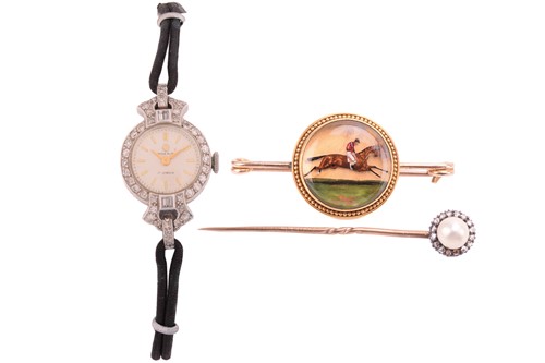 Lot 202 - A diamond cocktail watch with cord and leather...