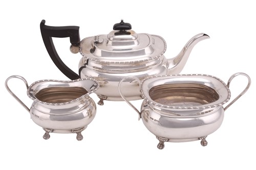 Lot 548 - A silver three-piece tea set, of oval form...