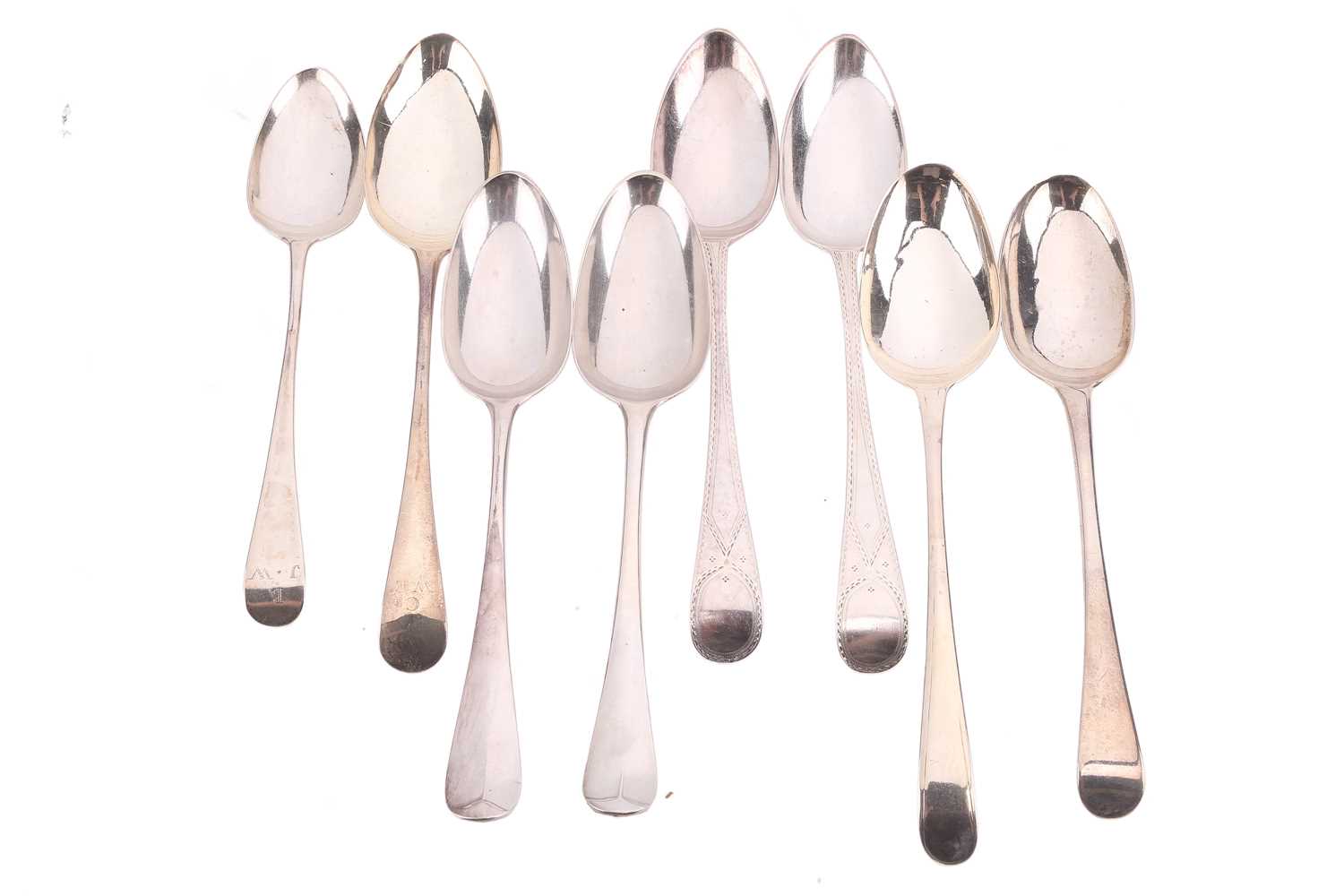 Lot 543 - Two pairs of George III silver tablespoons,...