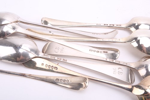 Lot 543 - Two pairs of George III silver tablespoons,...