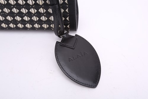 Lot 5 - Alaïa - two clutch bags in polished calfskin...