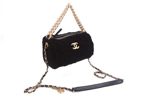 Lot 39 - Chanel - a small bowling bag in black velour,...