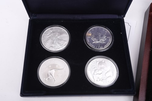 Lot 371 - Famous, silver, four coin collection,...
