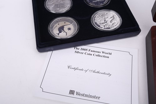 Lot 371 - Famous, silver, four coin collection,...