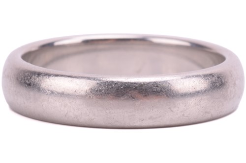 Lot 171 - Tiffany & Co. - a wedding band in oval court...