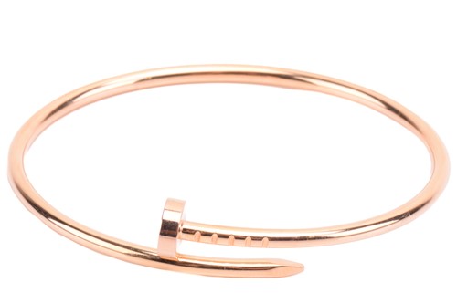 Lot 301 - Cartier - a 'Juste un Clou' bracelet in 18ct...