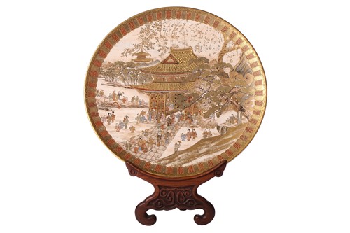 Lot 111 - A Japanese Satsuma pottery circular plate,...