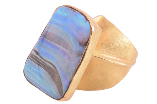 Lot 5 - A yellow metal and boulder opal dress ring;...