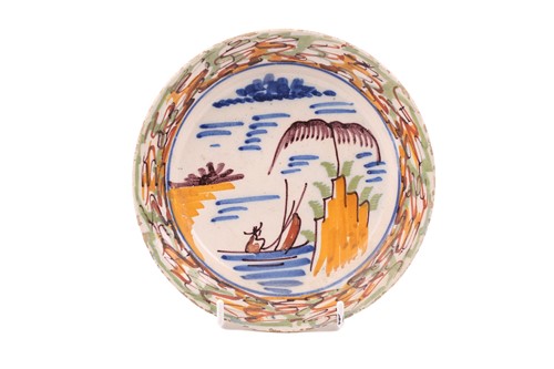 Lot 218 - A pair of 18th century polychrome delft plates,...