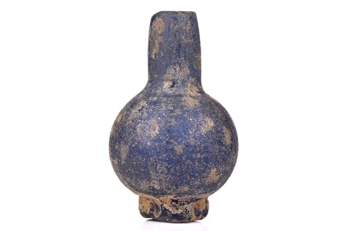 Lot 313 - An opaque blue Roman glass vase, probably...