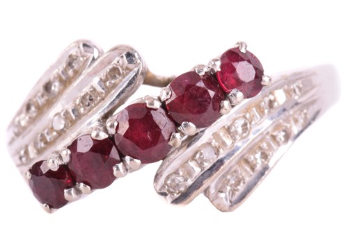 Lot 68 - A ruby and diamond crossover ring in 14ct...