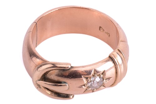 Lot 38 - A diamond-set ring of buckle design,...