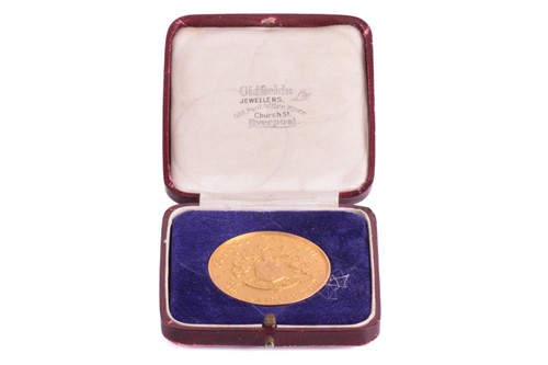 Lot 251 - A 15ct gold medal prize for woven cotton...