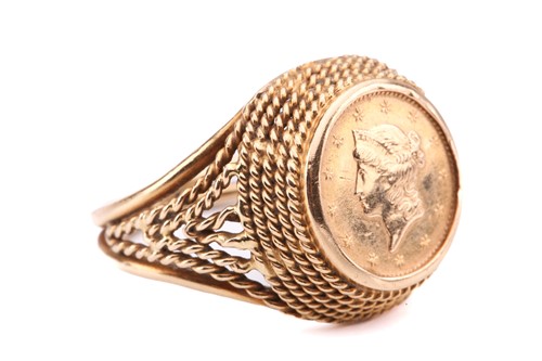 Lot 105 - A coin ring; centrally set with a one dollar...