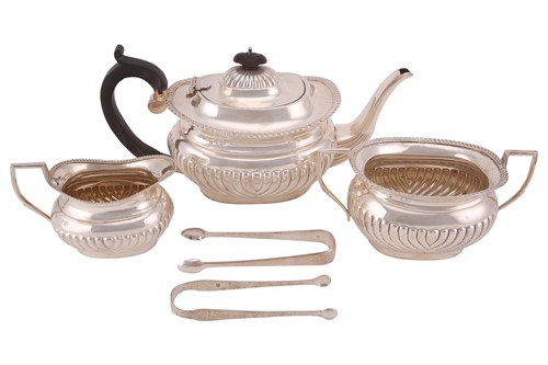 Lot 348 - A three-piece silver tea service in Queen Anne...