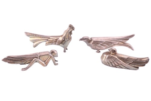 Lot 312 - Four silver plated knife rests in the manner...