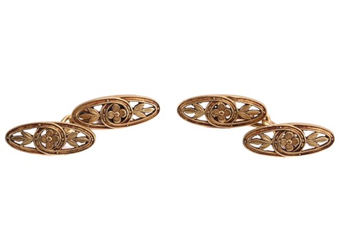 Lot 158 - A pair of pierced floral cufflinks, of oval...