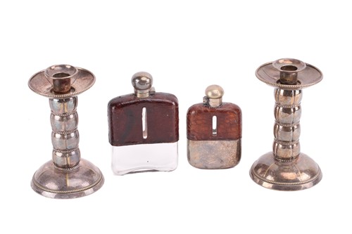 Lot 311 - A silver-mounted hipflask, the glass bottle...