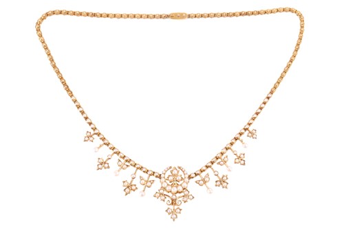 Lot 1 - A late Victorian seed pearl necklace featuring...