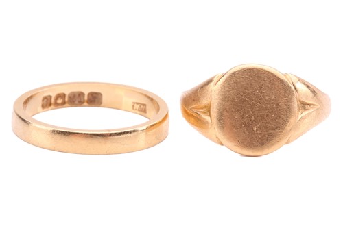 Lot 61 - Two 18ct yellow gold rings; to include a plain...