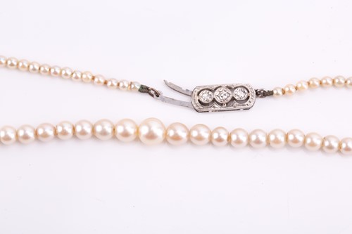 Lot 102 - A cultured pearl necklace, the largest pearl...